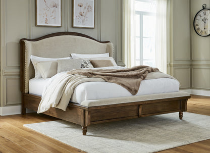 Pines Furniture Outlet - Ashley Furniture - Sturlayne Bedroom - King Upholstered Panel Bed / Brown - B787B4