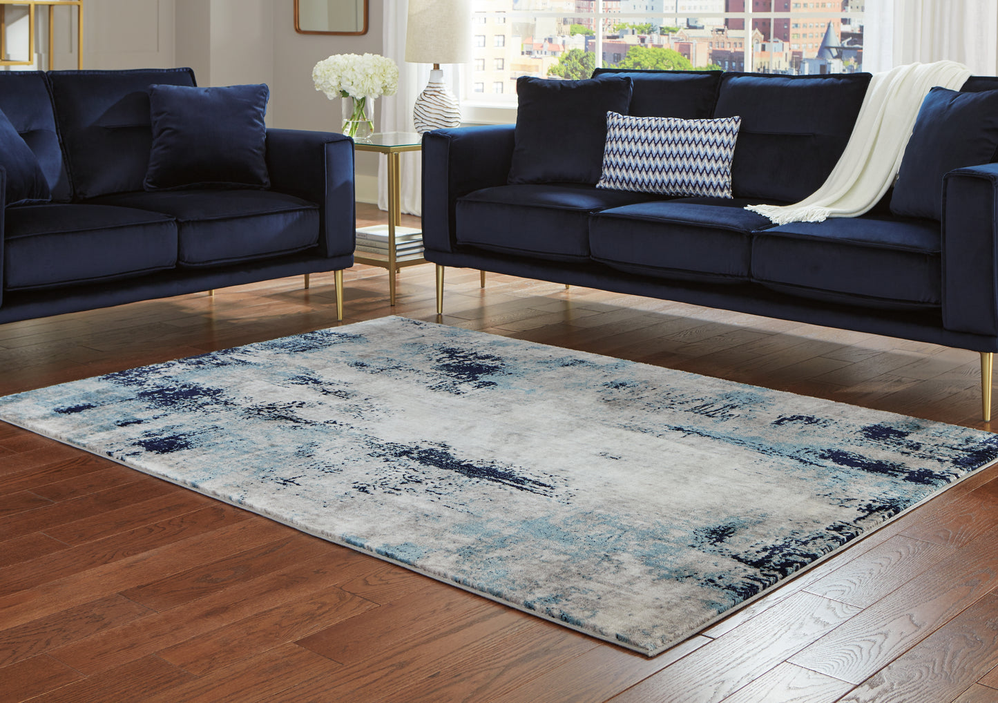 Pines Furniture Outlet - Ashley Furniture - Leonelle Rug - 7'10" x 10' Rug / White/Blue/Gray - R404871