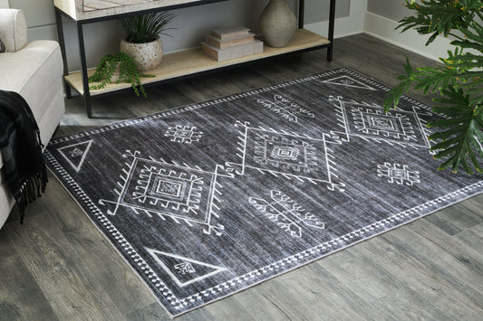 Pines Furniture Outlet - Ashley Furniture - Arloman Rug - 5' x 7' Washable Rug / Black/Cream/Gray - R405932
