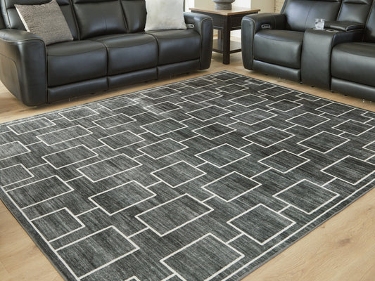 Pines Furniture Outlet - Ashley Furniture - Elderland Rug - Washable 5' x 7' Area Rug / Black/Gray - R407402