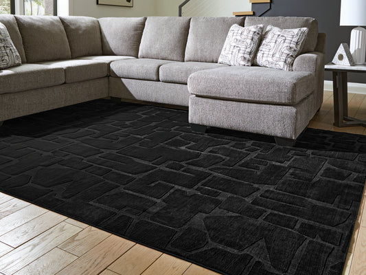 Pines Furniture Outlet - Ashley Furniture - Gibbswell Rug - Washable 8' x 10' Area Rug / Black - R407461