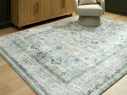 Pines Furniture Outlet - Ashley Furniture - Ladstoney Rug - 7'6" x 9'6" Area Rug / Teal/Beige/Ochre - R407501