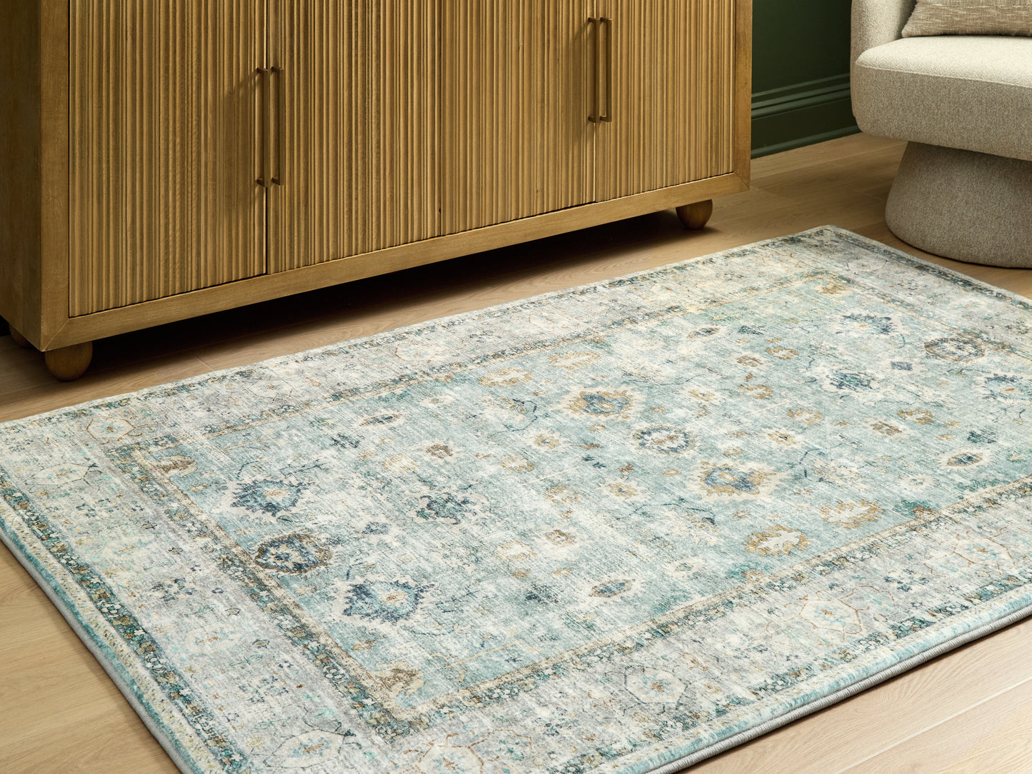Pines Furniture Outlet - Ashley Furniture - Ladstoney Rug - 7'6" x 9'6" Area Rug / Teal/Beige/Ochre - R407501