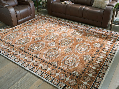 Pines Furniture Outlet - Ashley Furniture - Qaabiz Rug - 7'8" x 10' Area Rug / Sienna/Ivory/Black - R407521