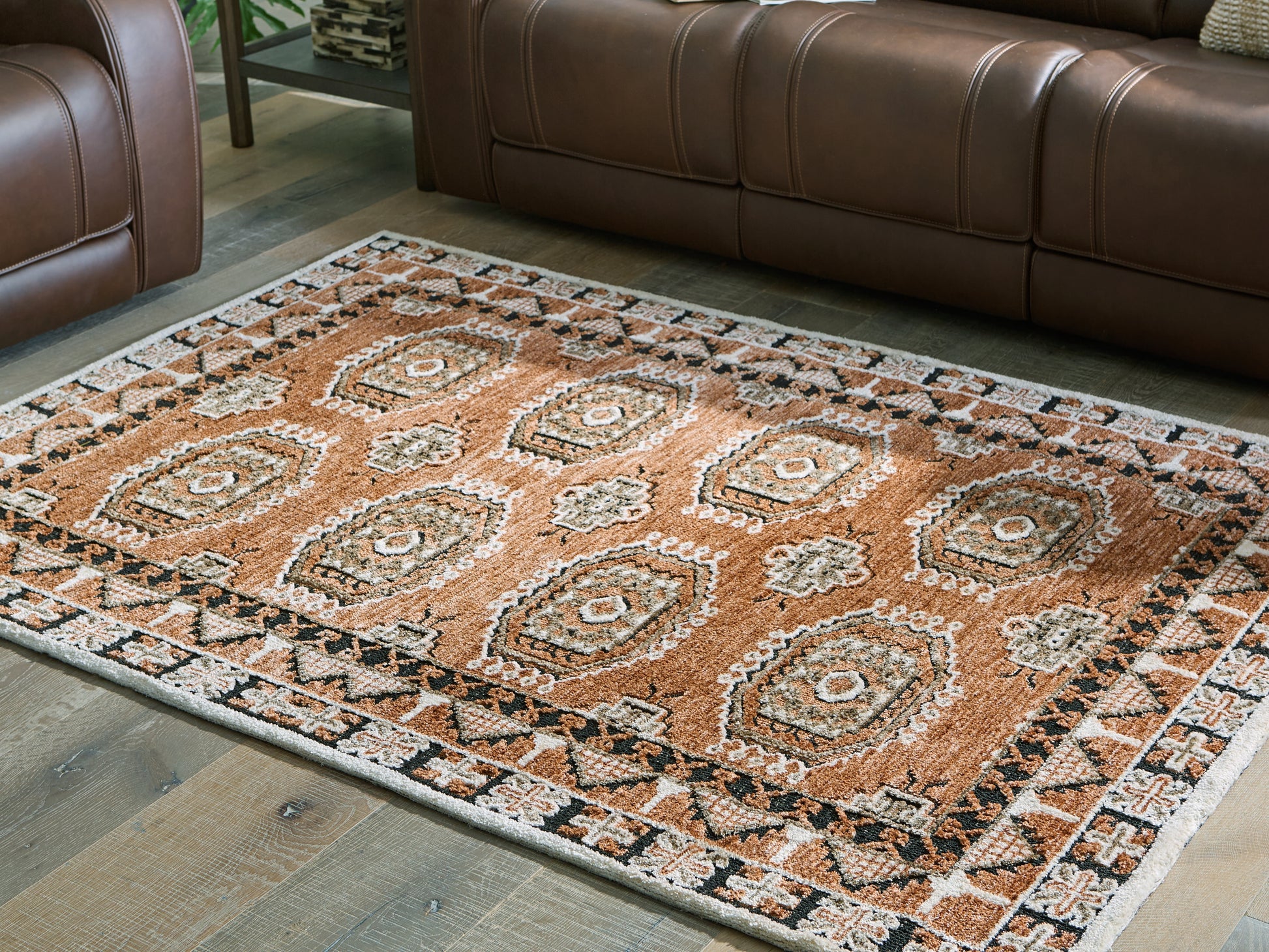 Pines Furniture Outlet - Ashley Furniture - Qaabiz Rug - 7'8" x 10' Area Rug / Sienna/Ivory/Black - R407521