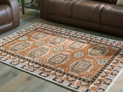 Pines Furniture Outlet - Ashley Furniture - Qaabiz Rug - 7'8" x 10' Area Rug / Sienna/Ivory/Black - R407521