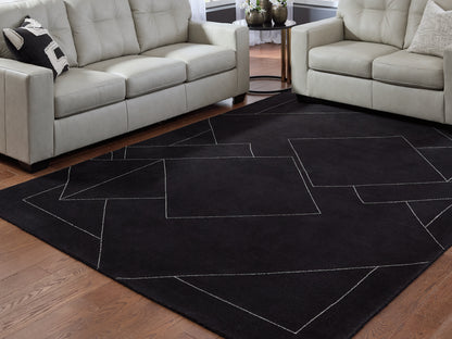 Pines Furniture Outlet - Ashley Furniture - Marav Rug - 5' x 7' Area Rug / Black/White - R407532