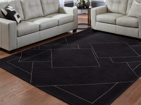 Pines Furniture Outlet - Ashley Furniture - Marav Rug - 5' x 7' Area Rug / Black/White - R407532