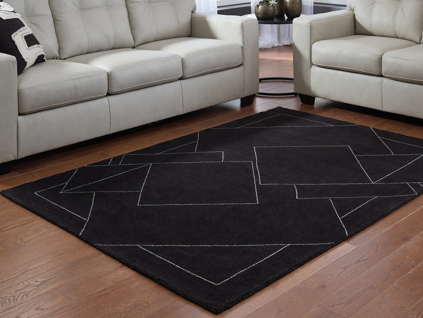 Pines Furniture Outlet - Ashley Furniture - Marav Rug - 5' x 7' Area Rug / Black/White - R407532