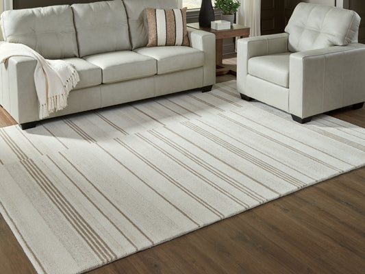 Pines Furniture Outlet - Ashley Furniture - Gadence Rug - 5' x 7' Area Rug / Ivory/Tan - R407642