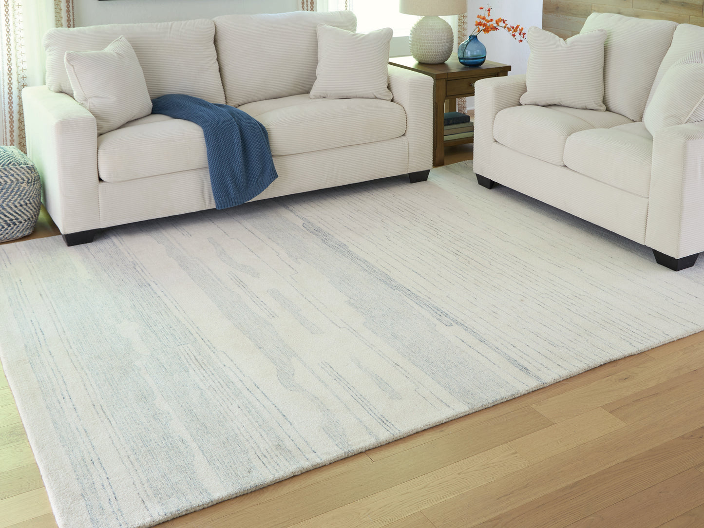 Pines Furniture Outlet - Ashley Furniture - Genemost Rug - 5' x 7' Area Rug / Ivory/Blue - R407842