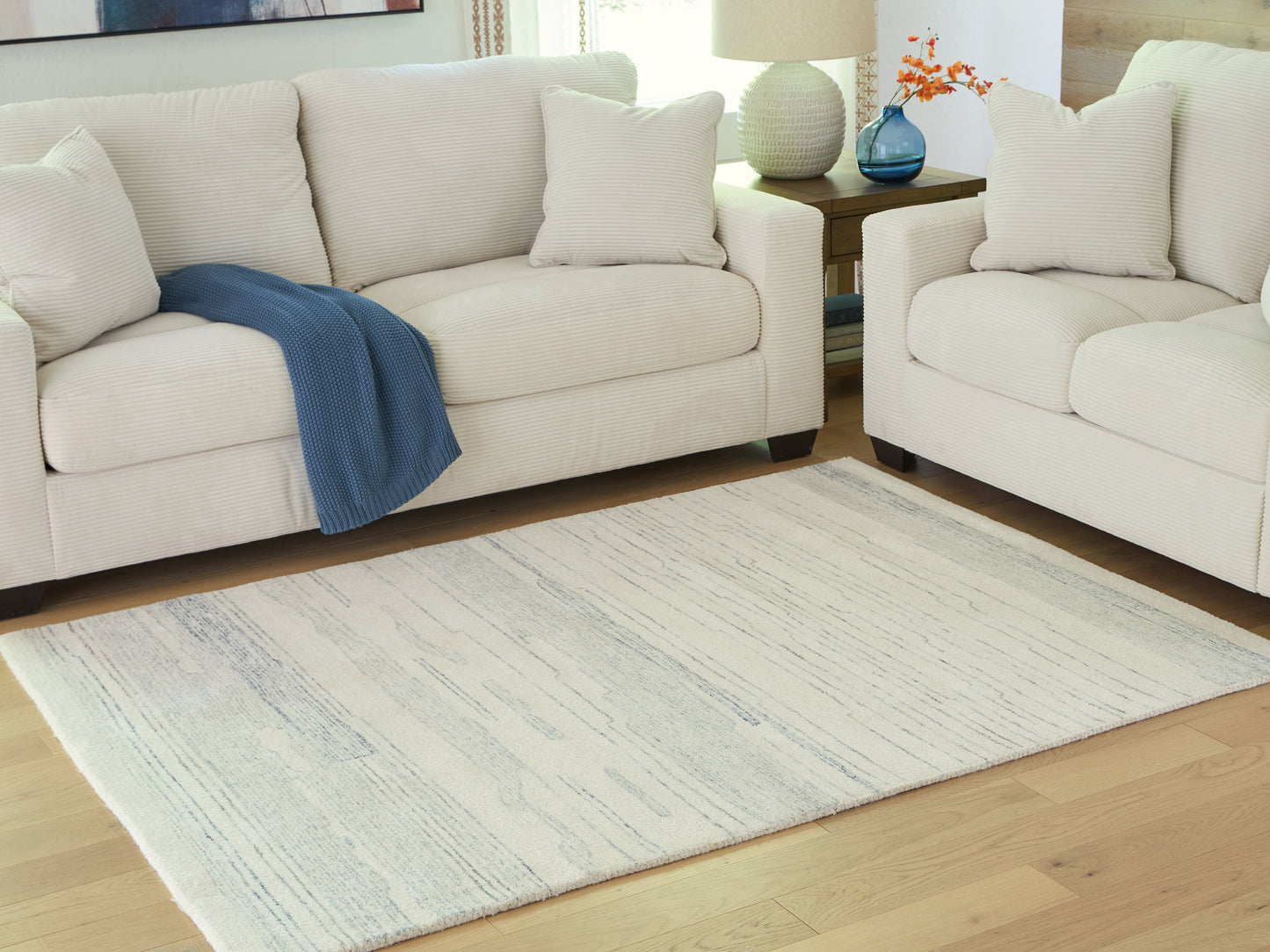 Pines Furniture Outlet - Ashley Furniture - Genemost Rug - 5' x 7' Area Rug / Ivory/Blue - R407842